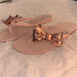 Woman’s Rose Gold Sz 6 Jelly Flip Flops w Bow